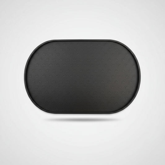 Tapis silicone gamelle chien noir ovale avec motifs pattes pour protéger le sol lors du repas